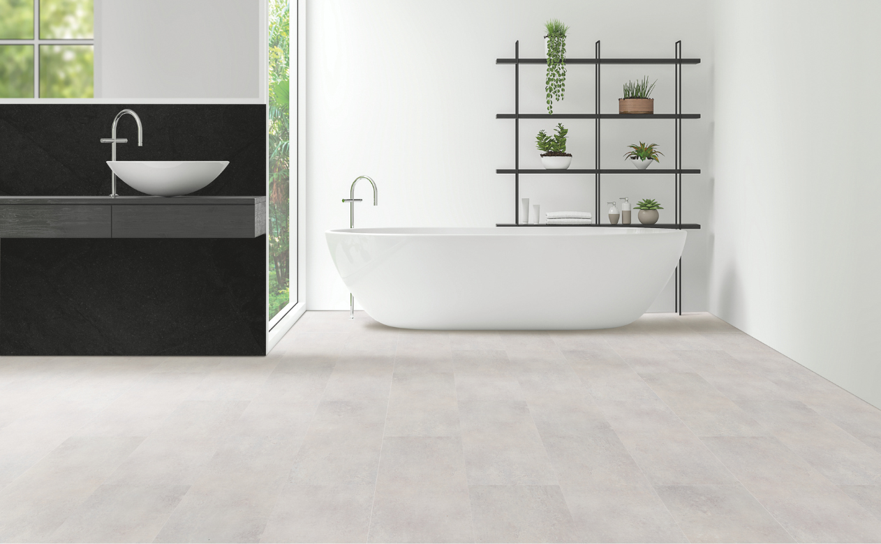 gray tile flooring in a bathroom with freestanding tub