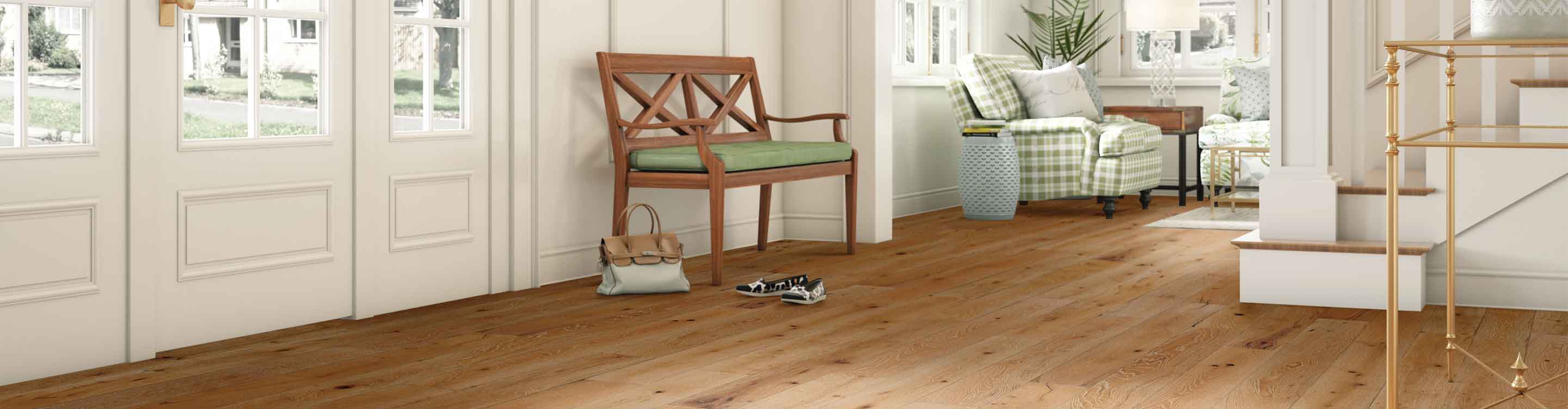 Medium toned hardwood with natural knots in entryway and living room